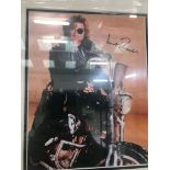 A framed & glazed signed photograph of Kurt Russell with COA