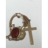 A 9ct crucifix brooch and pendant