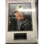 A framed and glazed signed photograph of Mickey Rooney with COA