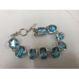 A silver and blue topaz bracelet