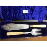 A cased HM silver and ivory fish servers,