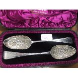 A cased HM silver George III serving spoons, Dublin, 1802, 1812,