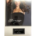 A framed and glazed signed photograph of Beyonce with COA