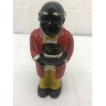 A cast-iron money bank in the form of a man