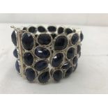 A silver and sapphire bracelet: hundreds of carats