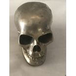 A white metal skull