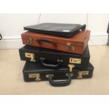 Three leather briefcases;