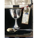 A cased HM silver egg cup and spoon