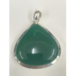 A green agate and silver pendant