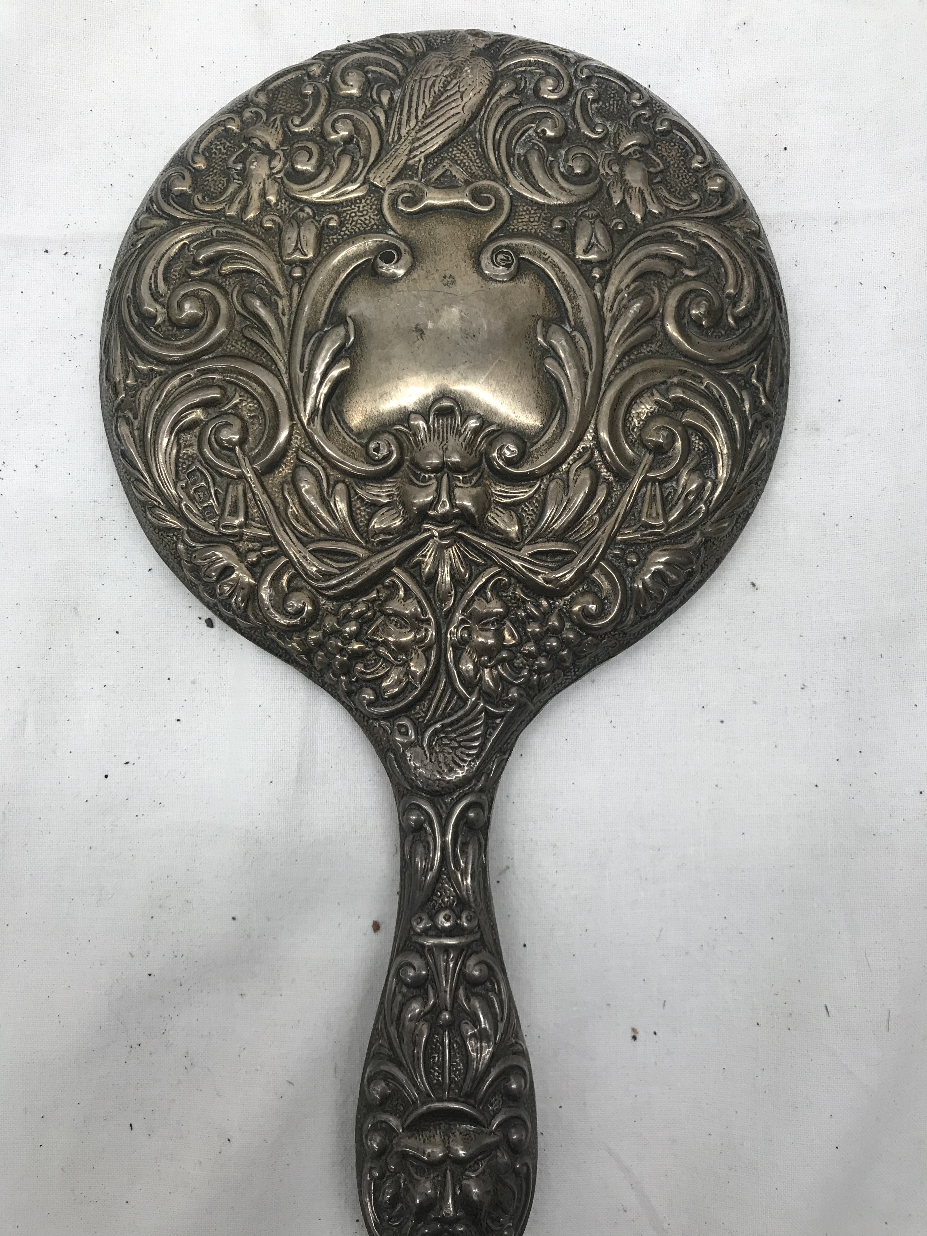 An early 20th century HM silver mirror