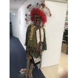 A Red Indian costume on a wicker mannequin