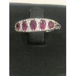 A 5-stone ruby and diamond ring set in 18ct white gold.