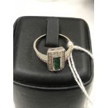 An Art Deco diamond and emerald ring