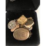 A quantity of gold lockets and silver medallions