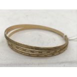 Three 9ct bangles with different bright cut design