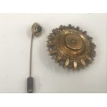 A Victorian gold brooch;