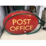 A double-sided 'Maidenbower Post Office' sign