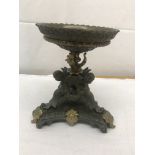 A bronze centrepiece with cherub decoration