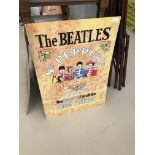 A Beatles 'Sgt Pepper' tin sign