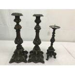 A pair of bronze candelabra;