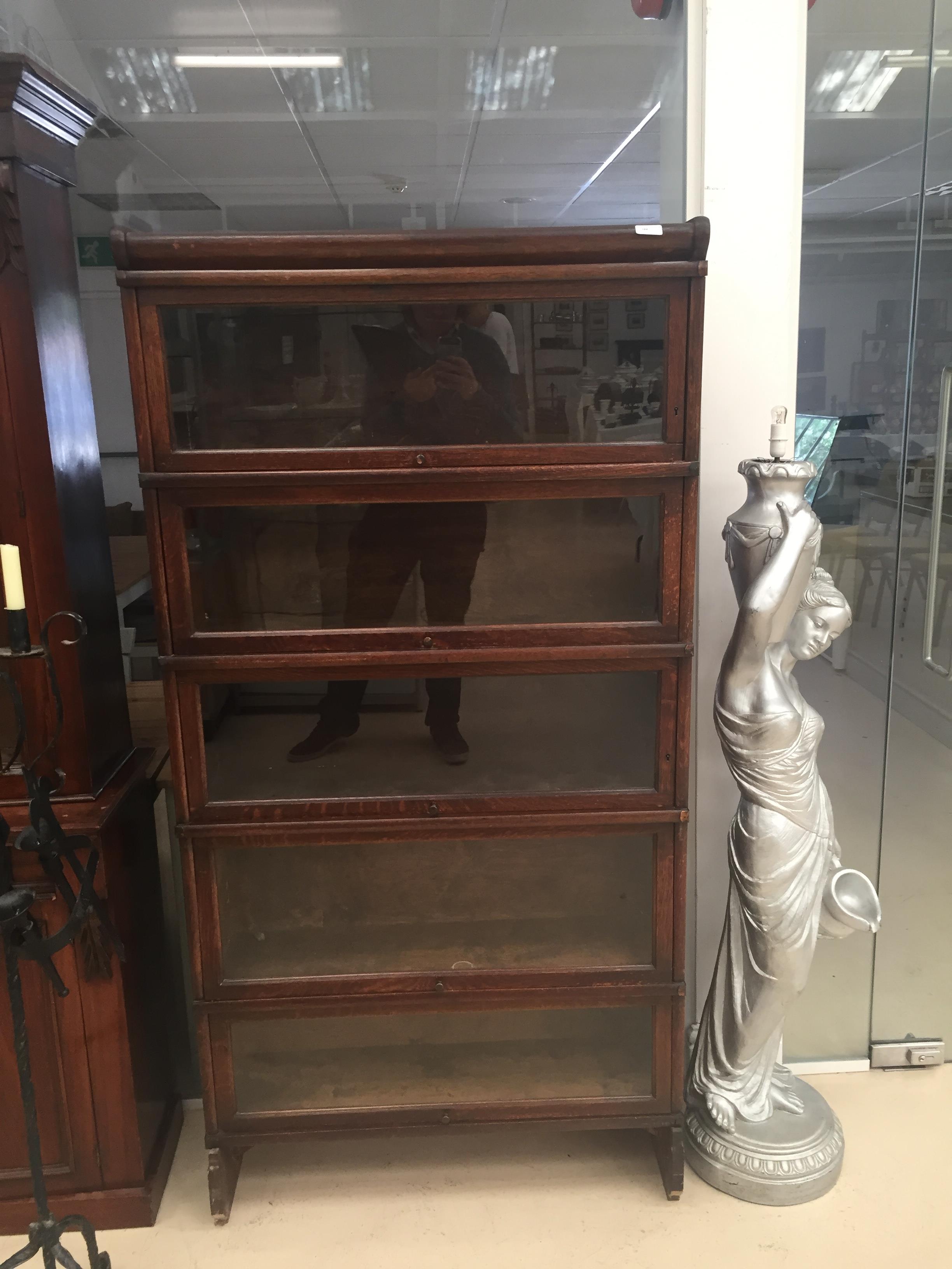 An oak 5 tier Globe Wernicke book case