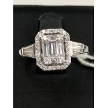 A 0.95ct G/VS1 diamond halo ring set in 18ct white gold