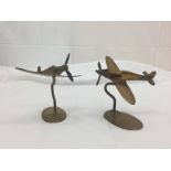 Two brass aeroplanes