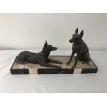 An art deco figure of 2 german shepherds on a marble base