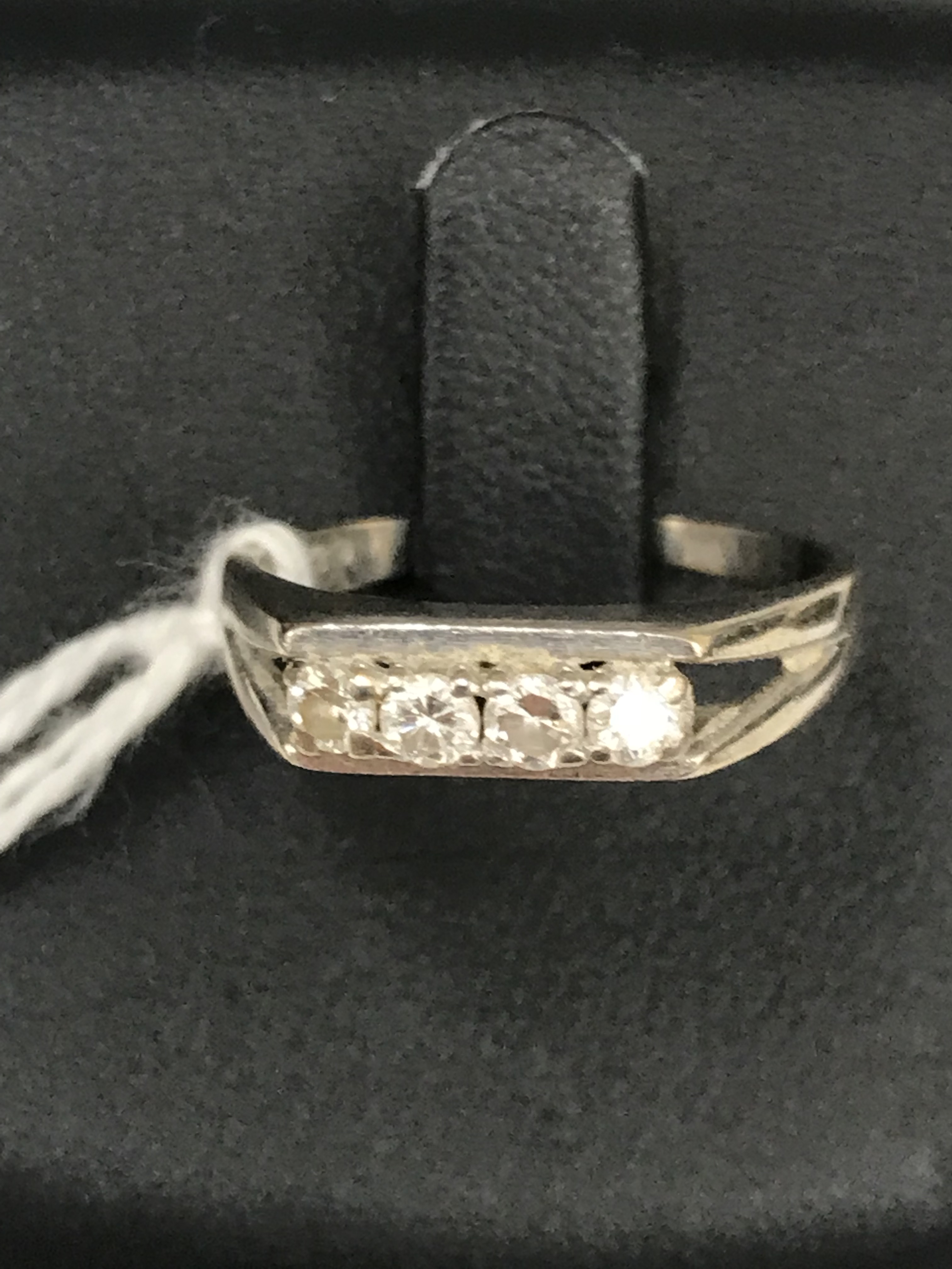An 18ct four-stone diamond ring