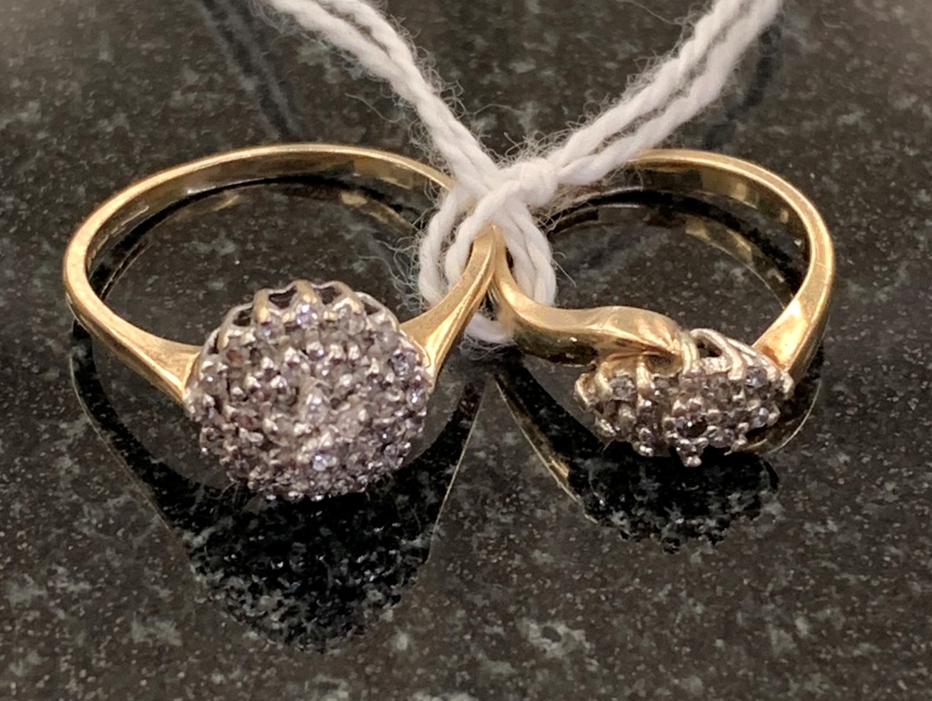 Two diamond cluster rings