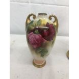 A Royal Worcester twin handled short necked vase, handpainted with roses. Signed M.