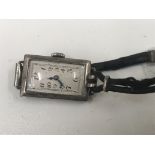 A vintage silver cocktail watch