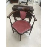 An Edwardian mahogany corner chair