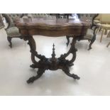 A 19th century walnut card table