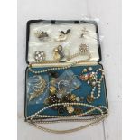 A quantity of dress jewellery to inc brooches,