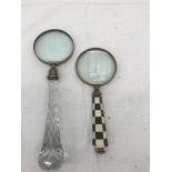 Two magnifying glasses with ornate handles