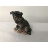 A Royal Copenhagen gold stamped figure of a german shepherd puppy