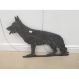 A metal gate sign of a german shepherd