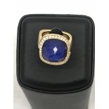 A Steven Webster 18 ct abstract ring, with Lapiz Lazuli central stone topped with faceted crystal,