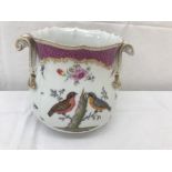 An early 20th century Meissen-style lidded handled vase with hand-painted birds and insects