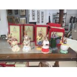 Eight Royal Doulton Bunnykins figures: 'Merlin', 'Tourist', 'Chorister', 'Easter Greetings',