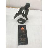 A Mark Hopkins signed bronze of a saxophone player (No 487 of 750)