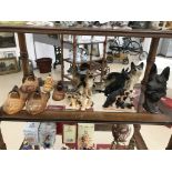 A shelf of german shepherd figures