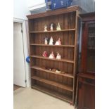 A large pine five-drawer bookcase