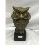Brass model of an owl