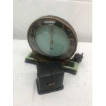 A cased miniature Zenith clock;