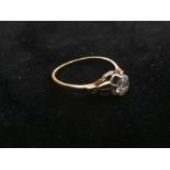 An 18ct gold diamond solitaire with half ct spread