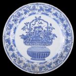 A Chinese blue and white charger 18th century Finely decorated with a basket of peonies and a band