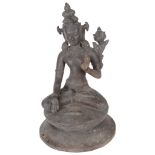 A Himalayan bronze figure 19th century Modelled as Avalokiteshvara sitting on a double lotus base