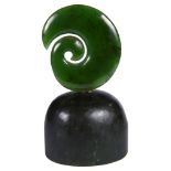 A Maori Nephrite Jade Koru Symbol: On nephrite base,